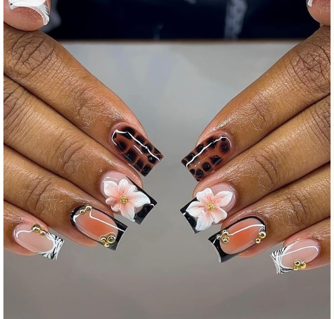 Floral and animal print nail art