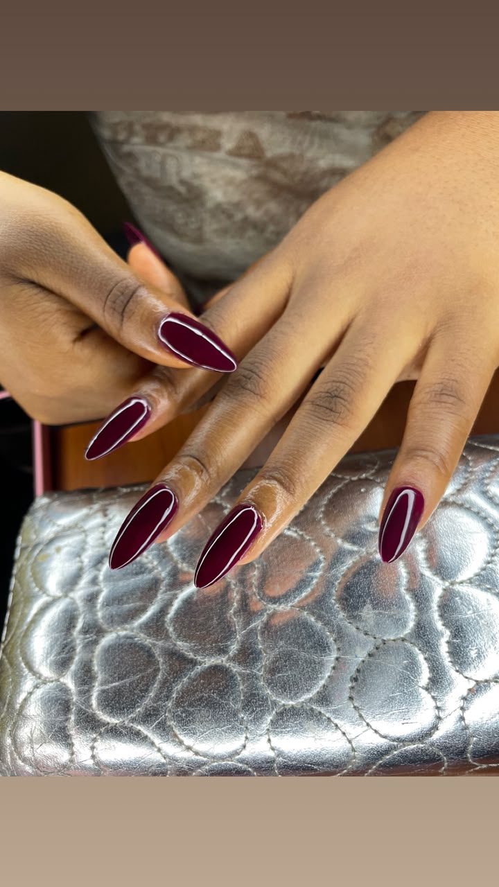 Deep wine coloured stiletto nails